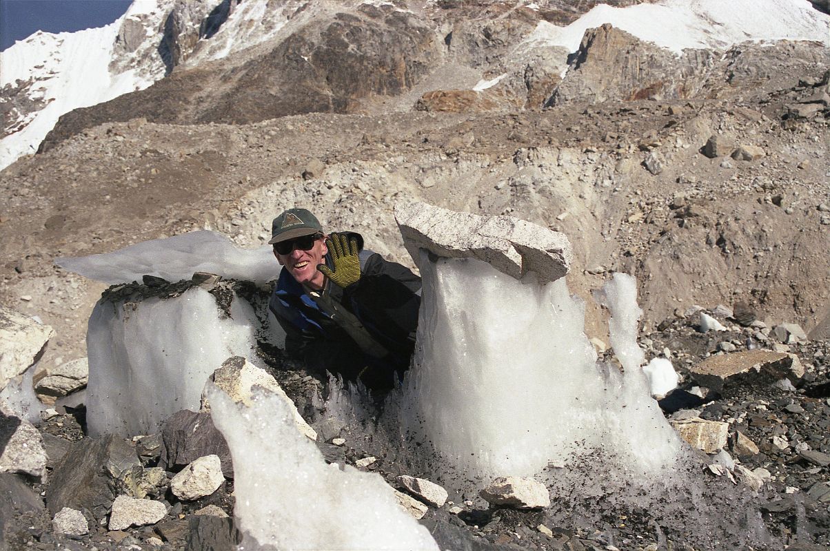 06 Jerome Ryan With Small Ice Penitente On Khumbu Glacier Trail To Everest Base Camp With Boulders Supported By Ice